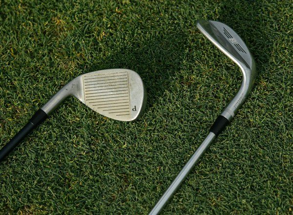 Golf club on green grass