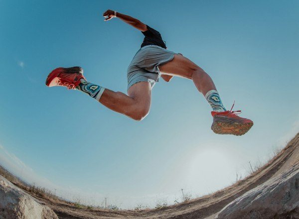 Trail runner leaping